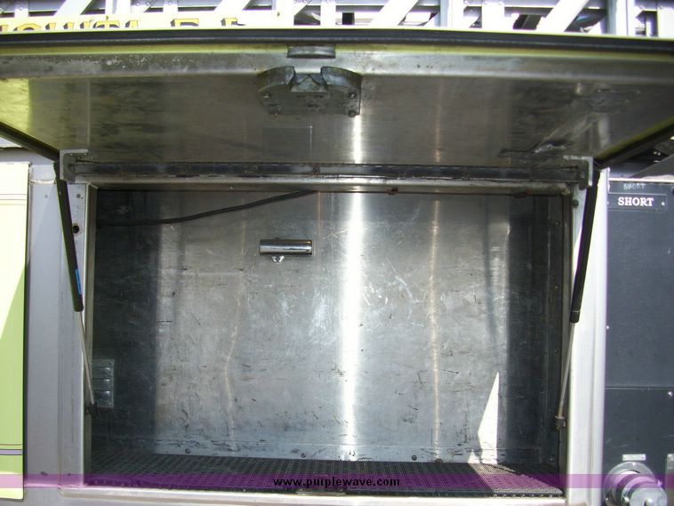 image for item 4652 1987 Sutphen MT1063 75' Quint pumper platform truck