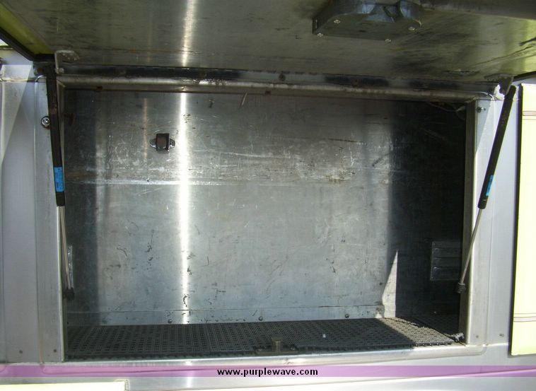 image for item 4652 1987 Sutphen MT1063 75' Quint pumper platform truck