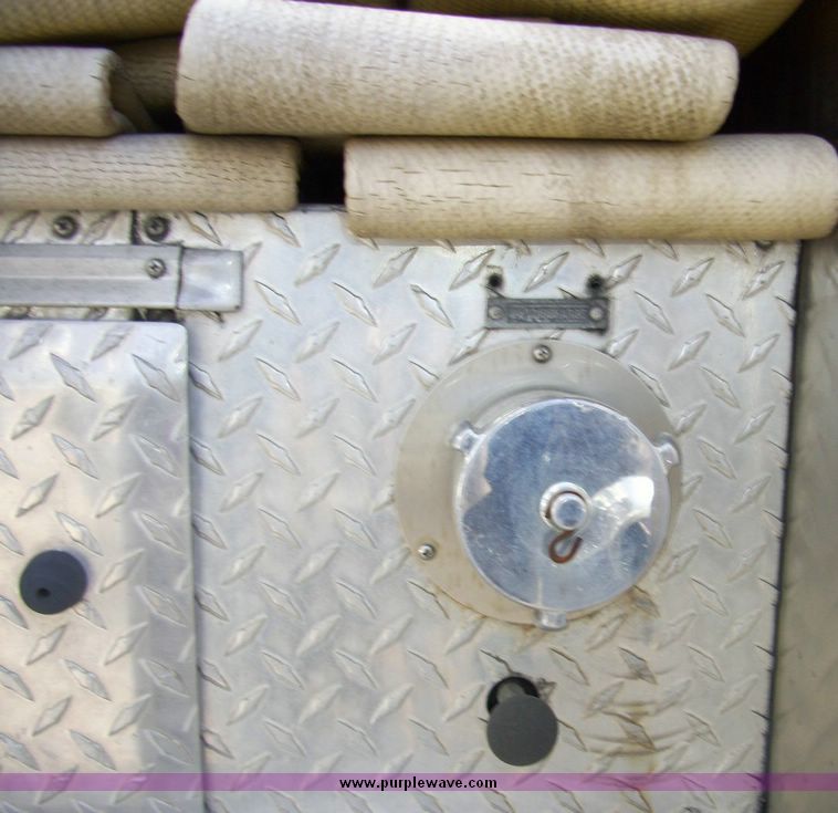 image for item 4652 1987 Sutphen MT1063 75' Quint pumper platform truck