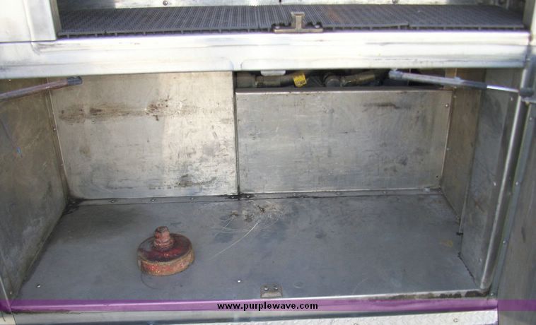image for item 4652 1987 Sutphen MT1063 75' Quint pumper platform truck