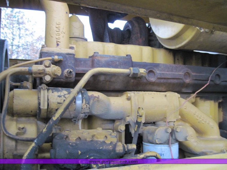 image for item 4585 Caterpillar 815 compactor