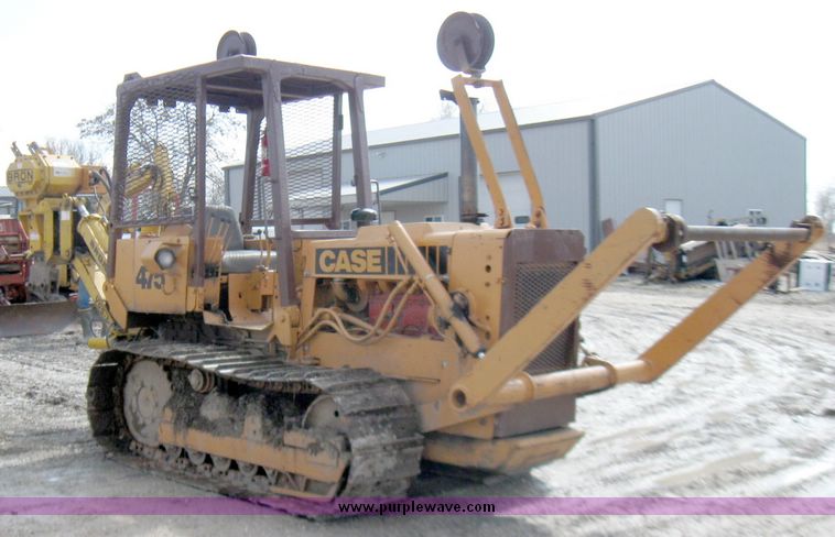 image for item 5693 Case 475 crawler tractor with vibratory plow