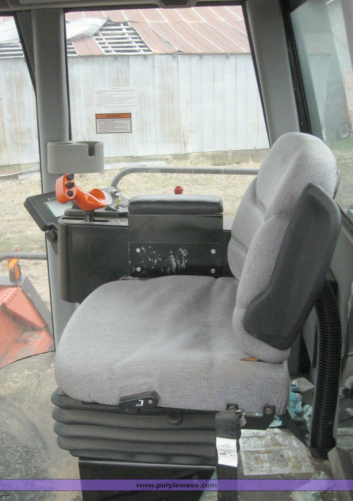 image for item 1450 2002 Hesston 8450 swather with 18' Header