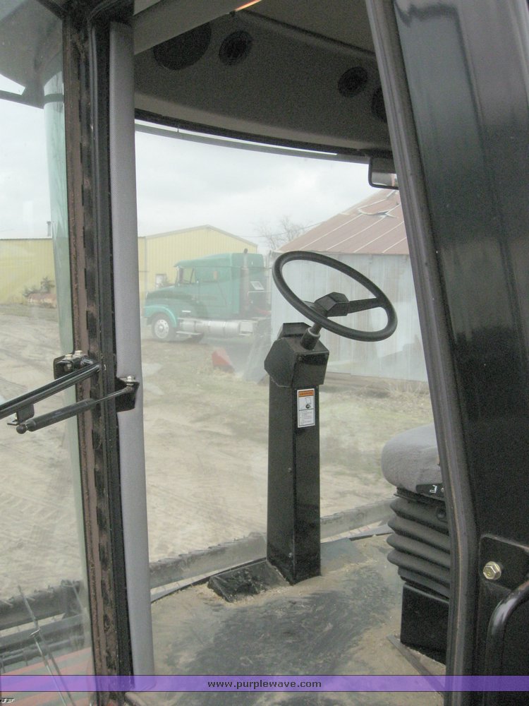 image for item 1450 2002 Hesston 8450 swather with 18' Header