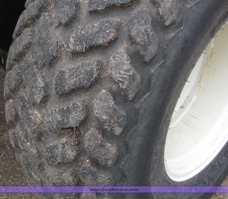 image for item 1450 2002 Hesston 8450 swather with 18' Header