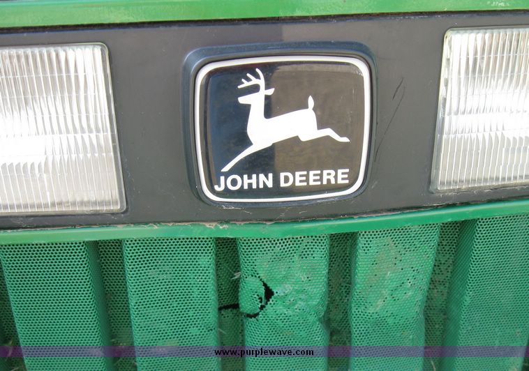 image for item 6800 2005 John Deere 990 MFWD tractor with John Deere 300CX loader