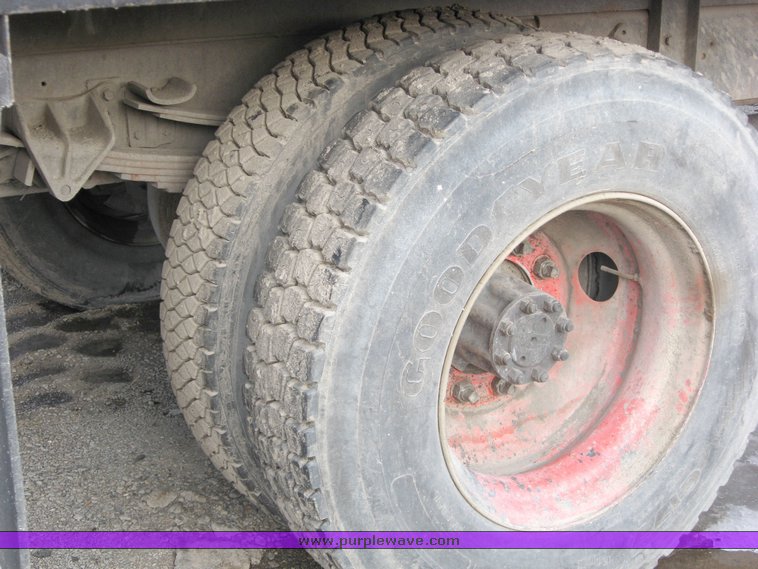 image for item 1023 1991 International Series 4700 flat bed truck with pavement sealer tank