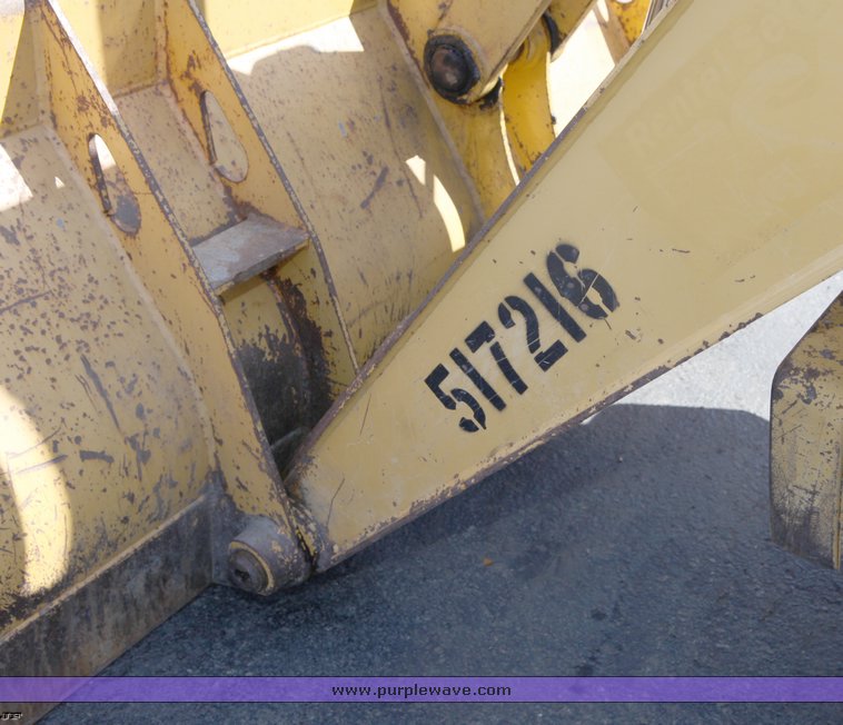 image for item 1006 2004 John Deere 310G MFWD loader backhoe