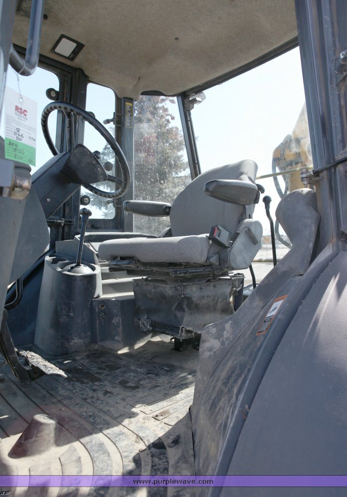 image for item 1006 2004 John Deere 310G MFWD loader backhoe