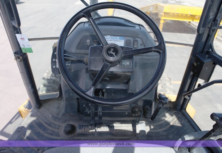 image for item 1006 2004 John Deere 310G MFWD loader backhoe