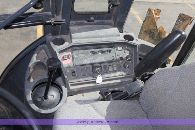 image for item 1006 2004 John Deere 310G MFWD loader backhoe