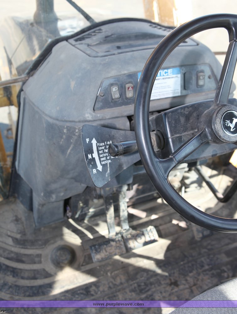 image for item 1006 2004 John Deere 310G MFWD loader backhoe