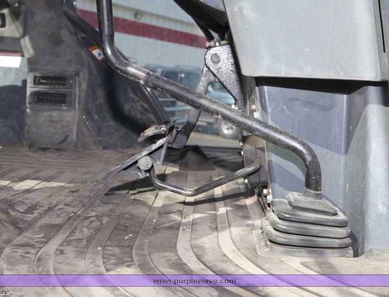 image for item 1006 2004 John Deere 310G MFWD loader backhoe