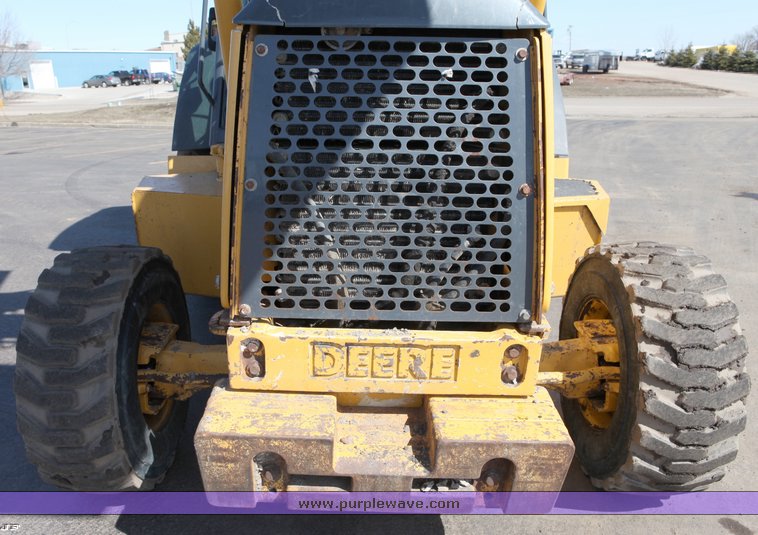 image for item 1006 2004 John Deere 310G MFWD loader backhoe