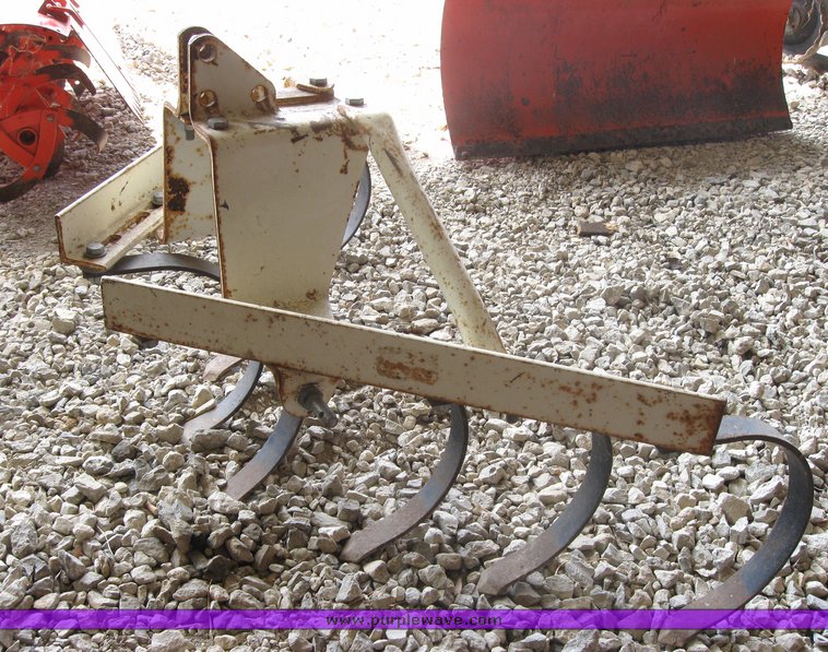 image for item 3416 Case 446 garden tractor with seven attachments