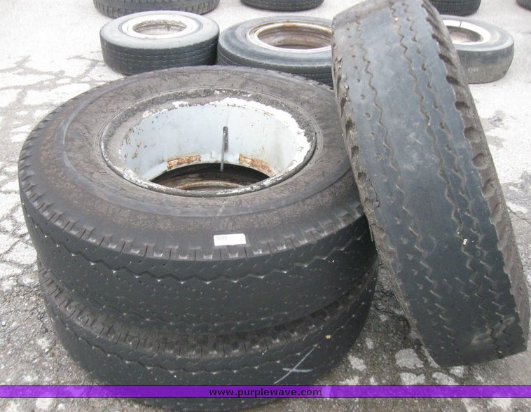 image for item 5606 (3) 10.00-20 tires and wheels