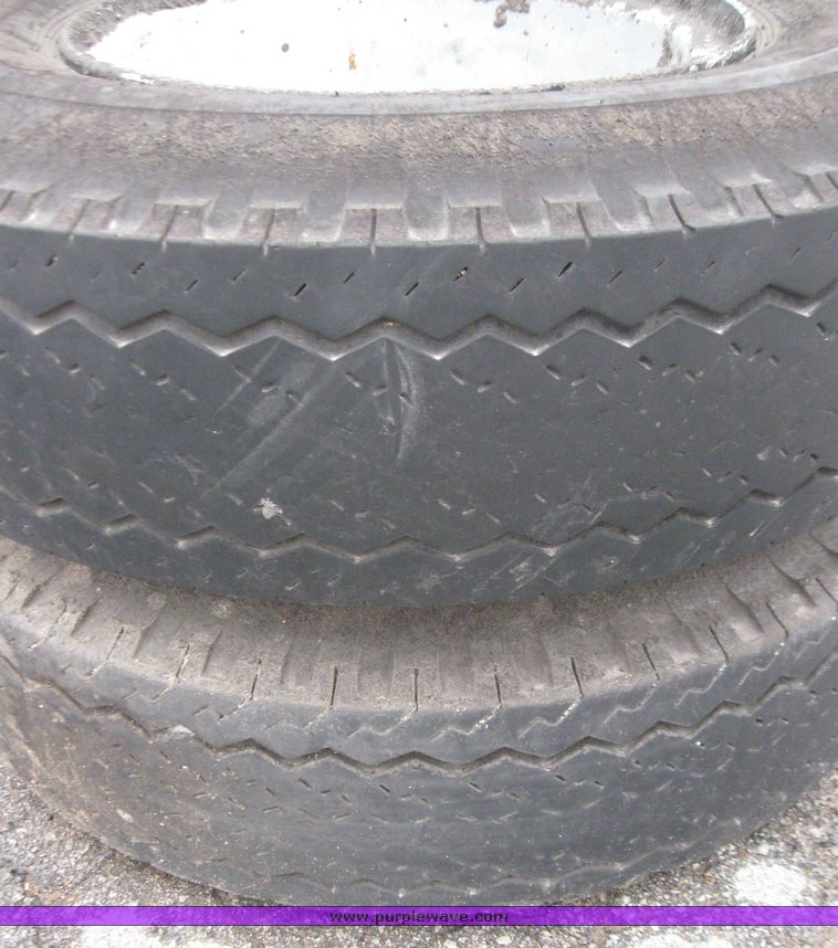 image for item 5606 (3) 10.00-20 tires and wheels