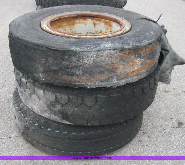 image for item 5609 (3) 10.00-20 tires and wheels