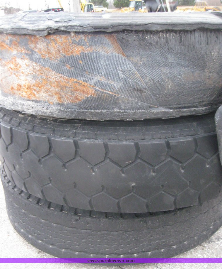 image for item 5609 (3) 10.00-20 tires and wheels