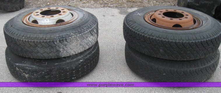 image for item 5611 (4) 10.00-20 tires and wheels