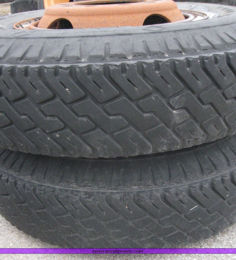 image for item 5611 (4) 10.00-20 tires and wheels