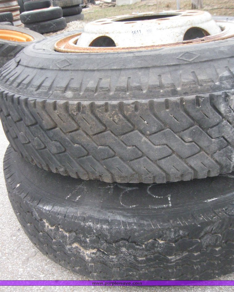 image for item 5611 (4) 10.00-20 tires and wheels