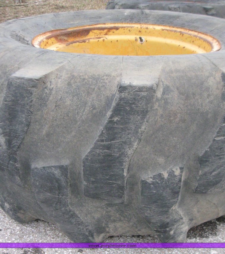 19.5L24 tires and wheel in Lawrence, KS Item 5614 sold Purple Wave