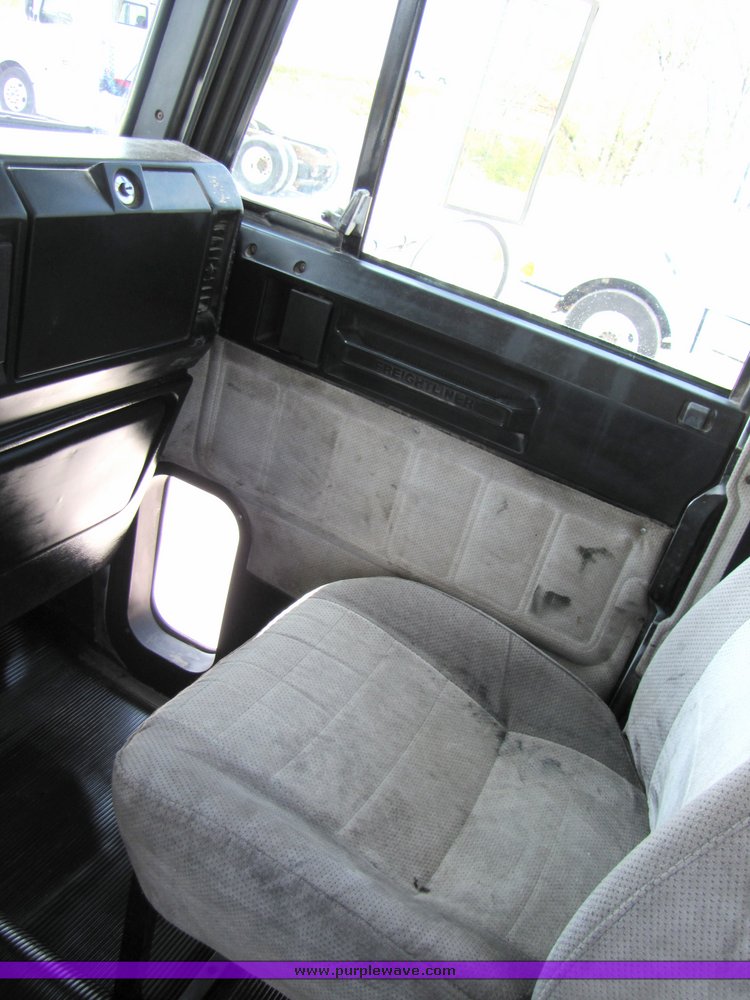 image for item 3053 1999 Freightliner Conventional FLD112 semi truck