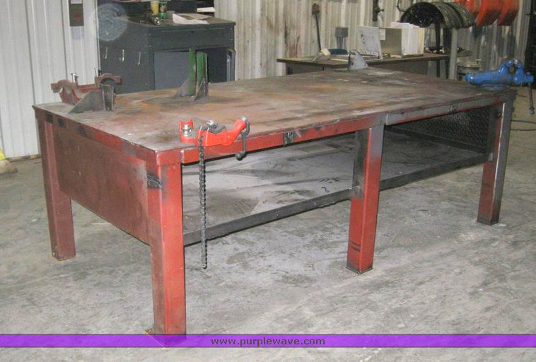 image for item 6330 4' x 8' x 33" metal work table with pipe clamp and vise