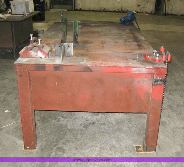 image for item 6330 4' x 8' x 33" metal work table with pipe clamp and vise