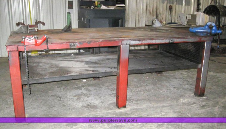 image for item 6330 4' x 8' x 33" metal work table with pipe clamp and vise