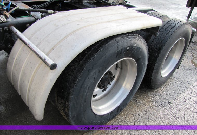 image for item 3106 2004 Freightliner Conventional Classic FLD120 semi truck