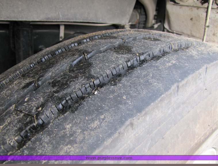 image for item 3106 2004 Freightliner Conventional Classic FLD120 semi truck