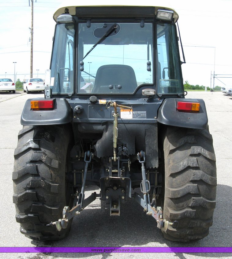 image for item 5004 2004 Mahindra 4510 4WD cab tractor with Mahindra ML114 loader and 6' bucket