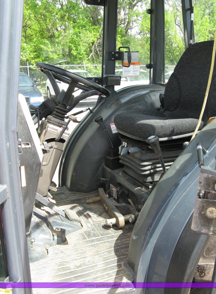 image for item 5004 2004 Mahindra 4510 4WD cab tractor with Mahindra ML114 loader and 6' bucket