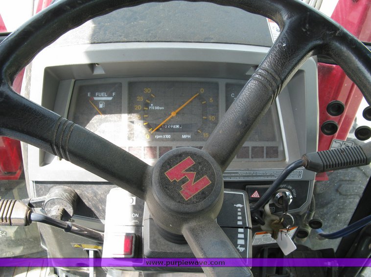 image for item 5004 2004 Mahindra 4510 4WD cab tractor with Mahindra ML114 loader and 6' bucket