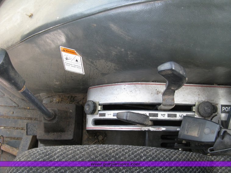 image for item 5004 2004 Mahindra 4510 4WD cab tractor with Mahindra ML114 loader and 6' bucket