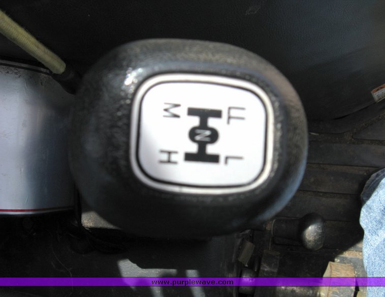 image for item 5004 2004 Mahindra 4510 4WD cab tractor with Mahindra ML114 loader and 6' bucket