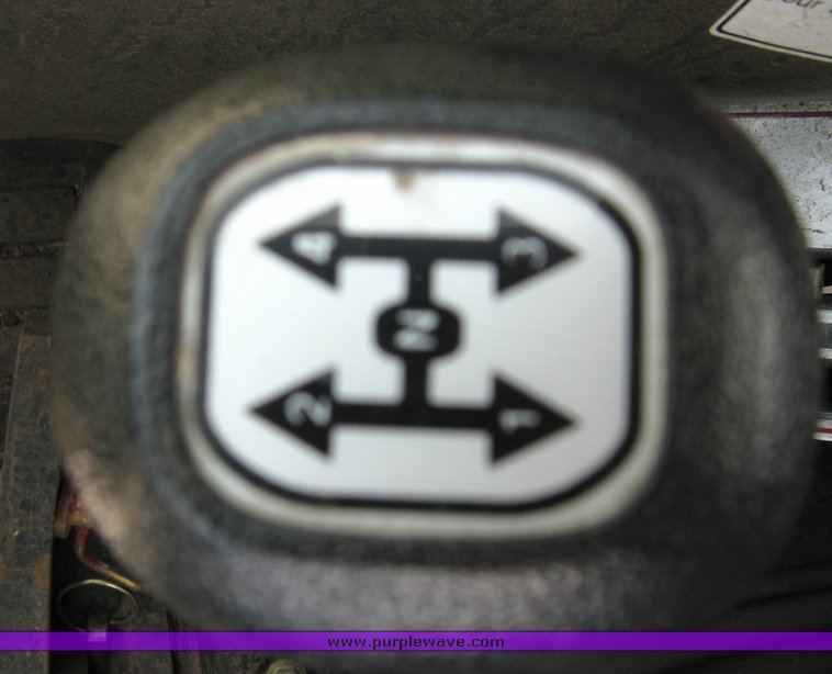 image for item 5004 2004 Mahindra 4510 4WD cab tractor with Mahindra ML114 loader and 6' bucket