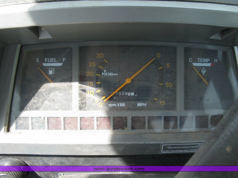 image for item 5004 2004 Mahindra 4510 4WD cab tractor with Mahindra ML114 loader and 6' bucket