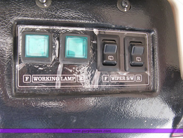 image for item 5004 2004 Mahindra 4510 4WD cab tractor with Mahindra ML114 loader and 6' bucket