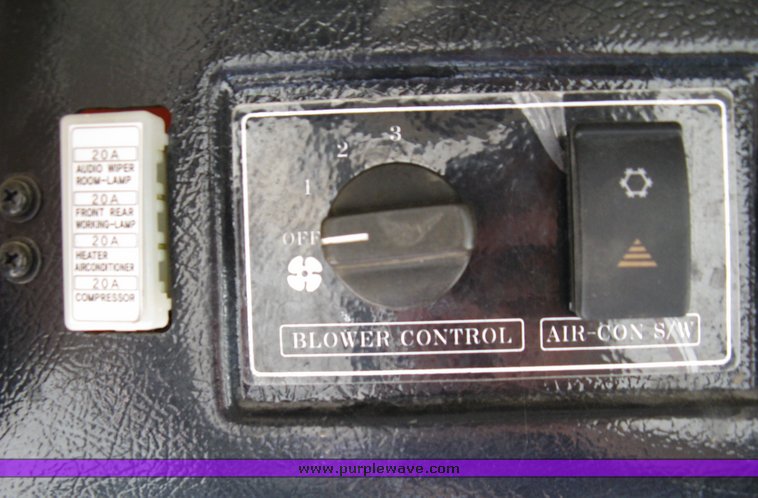 image for item 5004 2004 Mahindra 4510 4WD cab tractor with Mahindra ML114 loader and 6' bucket