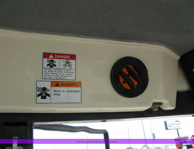 image for item 5004 2004 Mahindra 4510 4WD cab tractor with Mahindra ML114 loader and 6' bucket