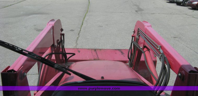 image for item 5004 2004 Mahindra 4510 4WD cab tractor with Mahindra ML114 loader and 6' bucket