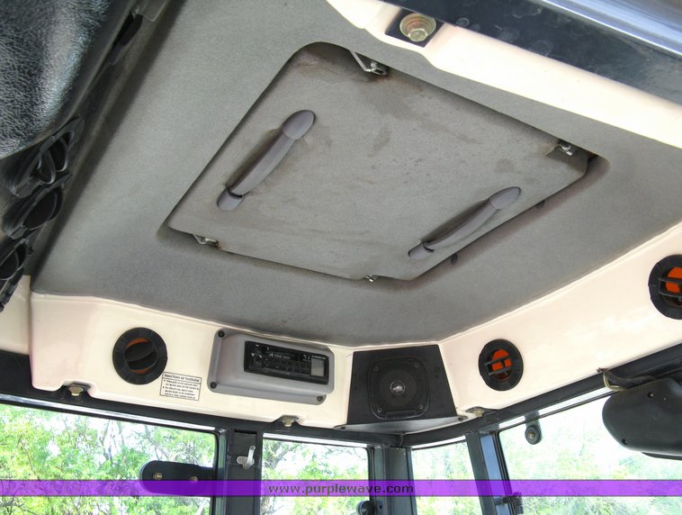 image for item 5004 2004 Mahindra 4510 4WD cab tractor with Mahindra ML114 loader and 6' bucket