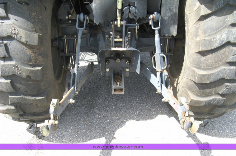 image for item 5004 2004 Mahindra 4510 4WD cab tractor with Mahindra ML114 loader and 6' bucket