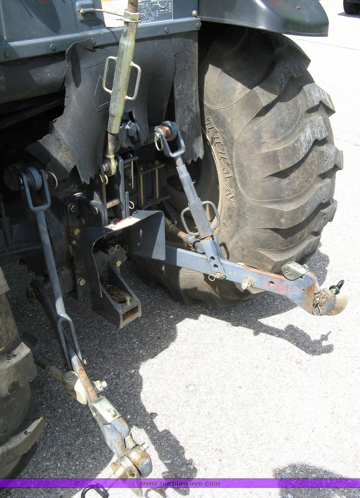 image for item 5004 2004 Mahindra 4510 4WD cab tractor with Mahindra ML114 loader and 6' bucket