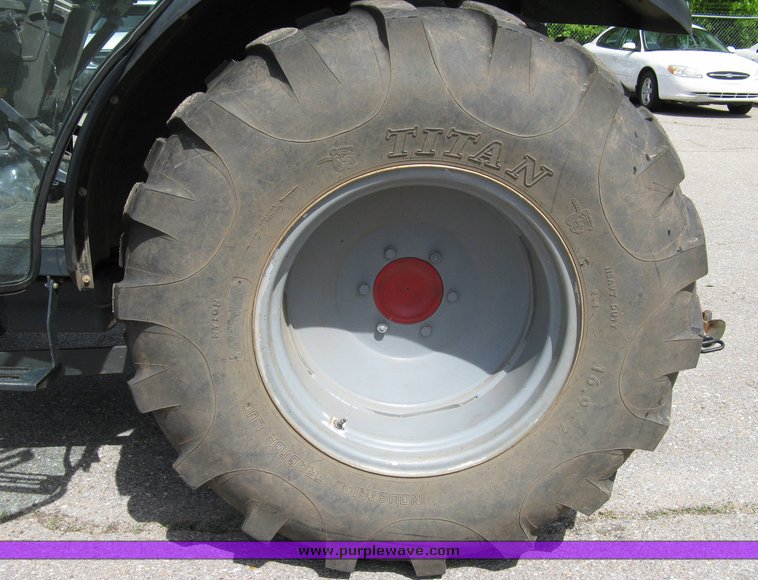 image for item 5004 2004 Mahindra 4510 4WD cab tractor with Mahindra ML114 loader and 6' bucket