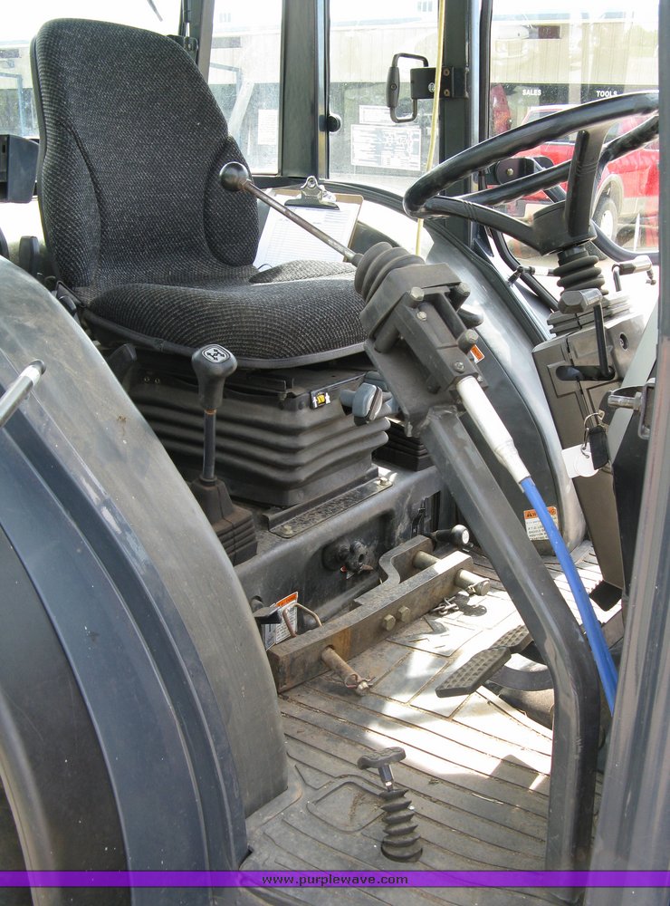 image for item 5004 2004 Mahindra 4510 4WD cab tractor with Mahindra ML114 loader and 6' bucket