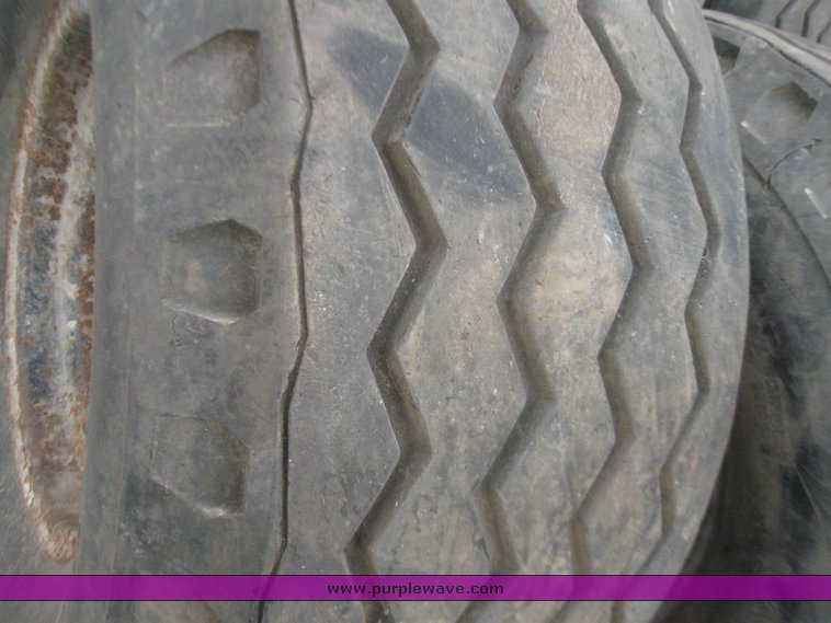image for item 7355 (6) 14.5/75-16 tires on 8 hole rims